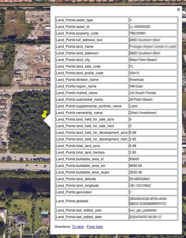 Google earth, with a pin selected. A popup dialog displays a table with Land_Points:asset_type, Land_Points:asset_id, and other Land_Points data.