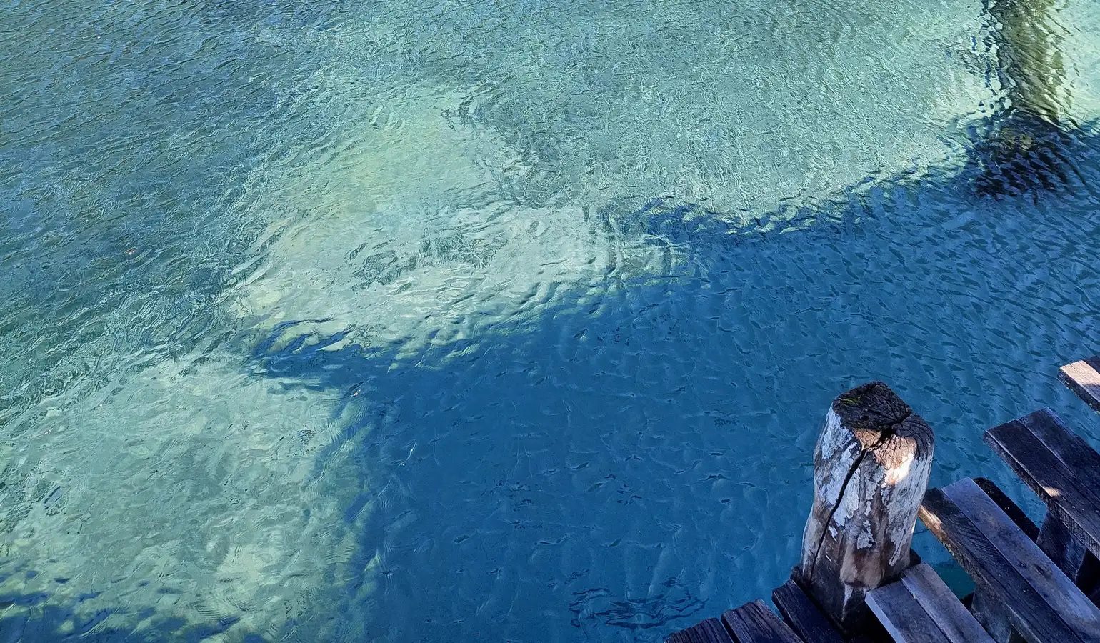 Shallow water and an old wood dock in southern Patagonia, Argentina
